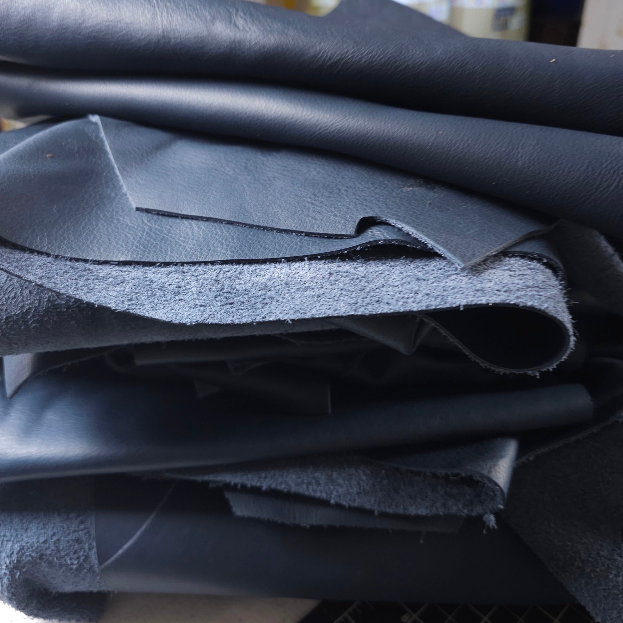 Midnight blue full-grain leather scraps, 1–2 sq ft, soft with natural markings.