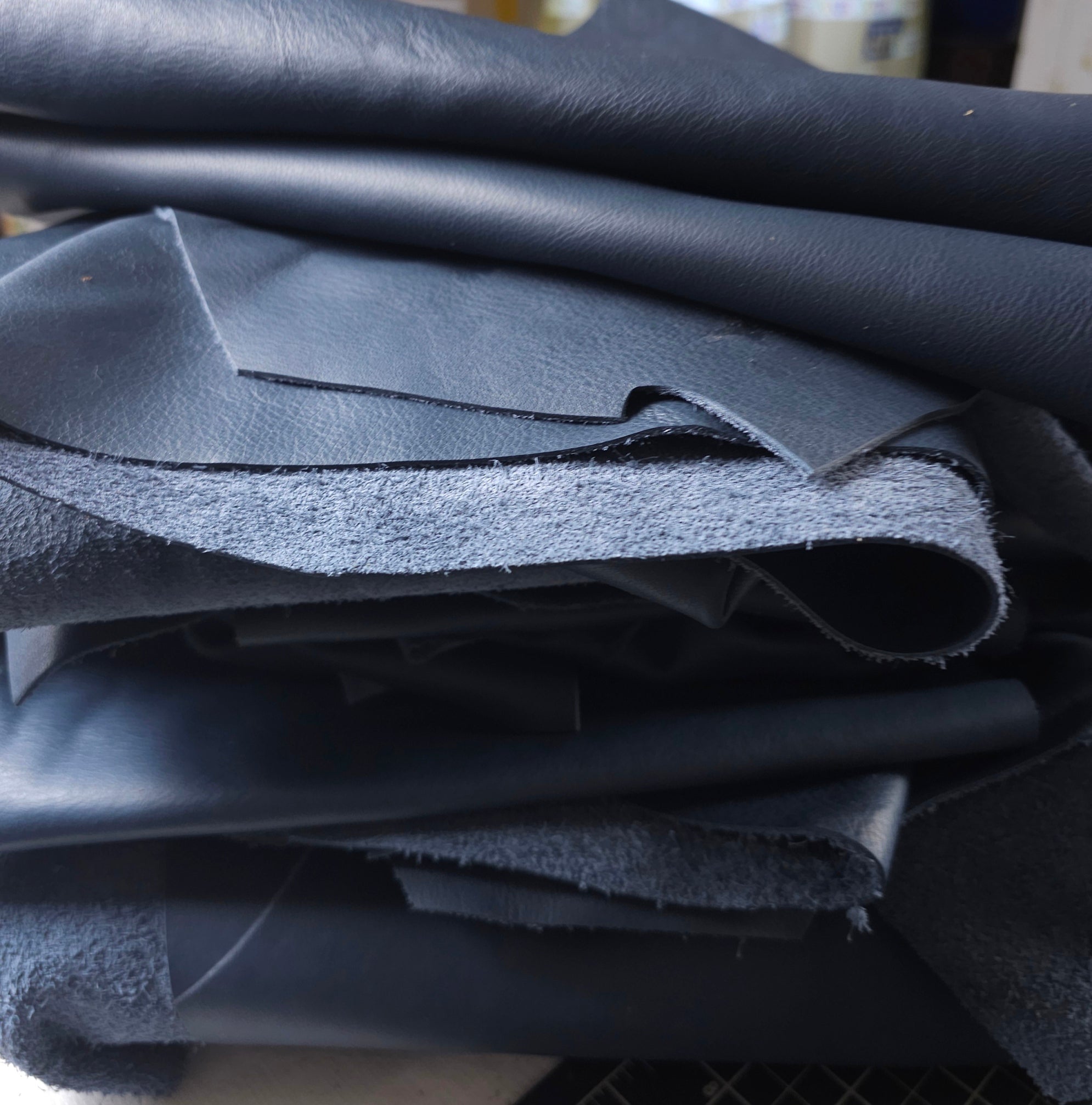 Midnight blue full-grain leather scraps, 1–2 sq ft, soft with natural markings.