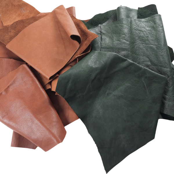 Pack of vegetable-tanned leather scraps in Forest Green and Tan, varying shapes and textures.
