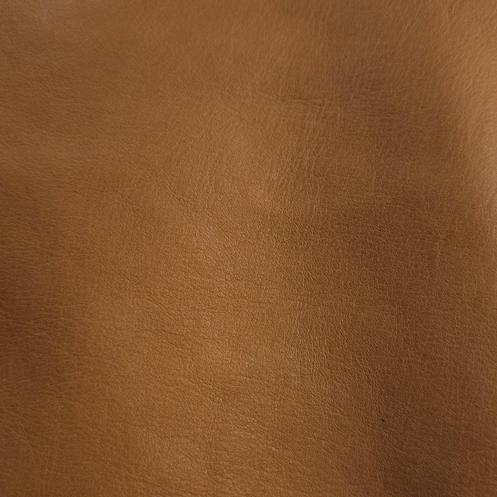  Close-up of almond brown cowhide texture