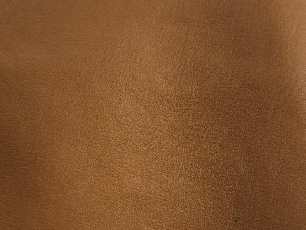  Close-up of almond brown cowhide texture