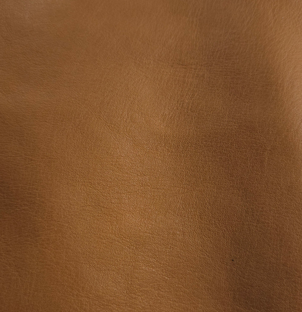  Close-up of almond brown cowhide texture