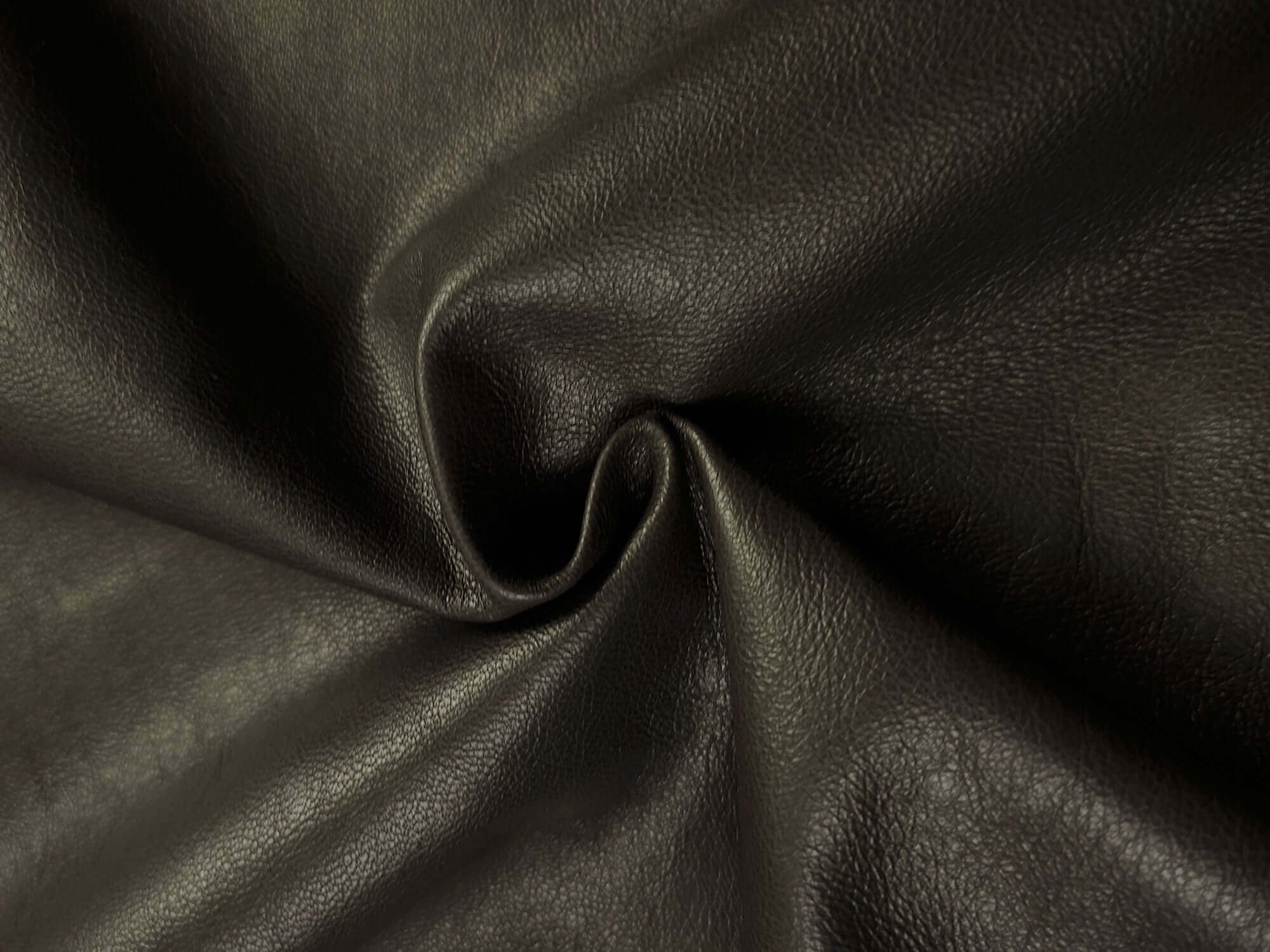 Closeup of Dark brown sheepskin leather 13 - 14 sq ft