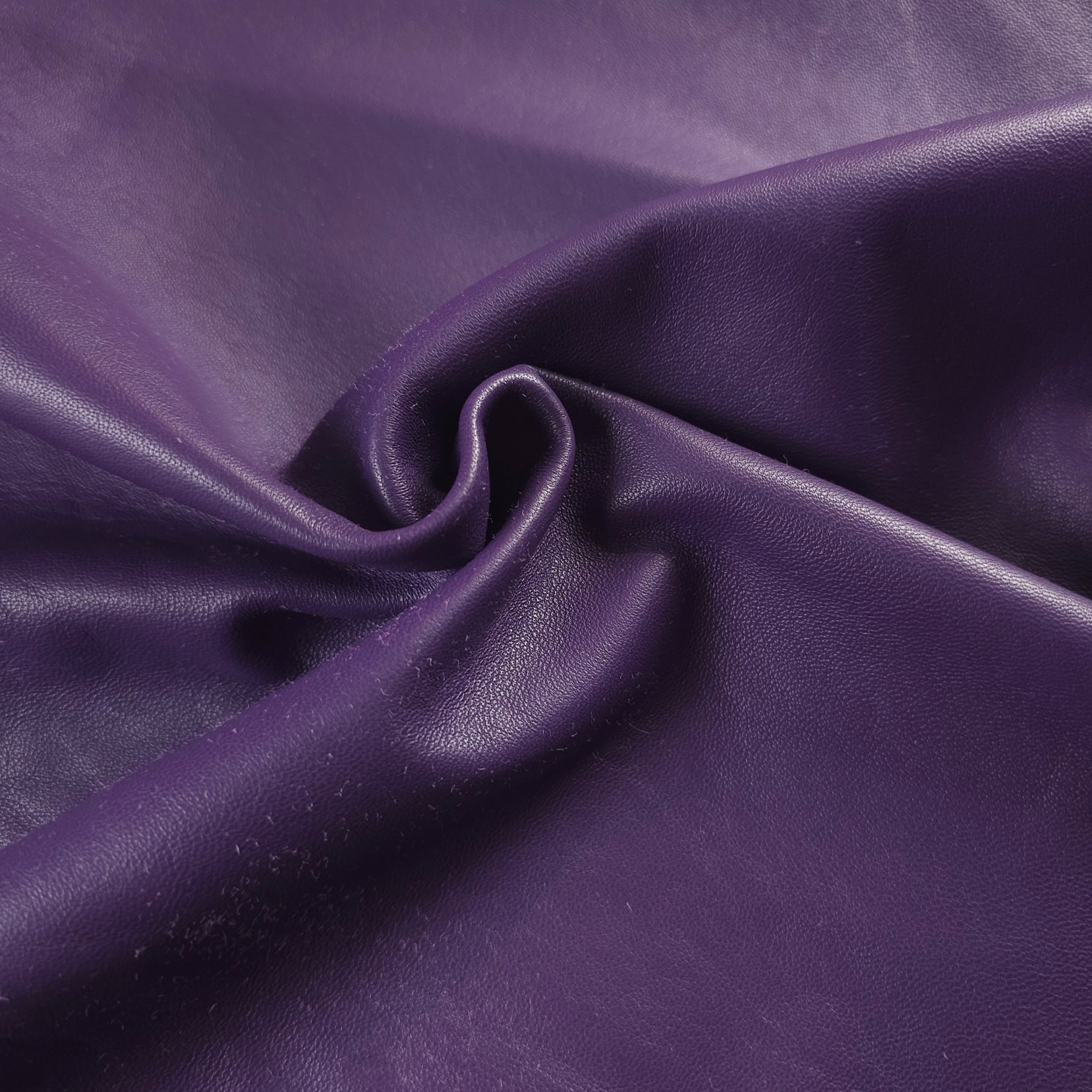 Buttery soft Sheepskin Nappa hides draped on table