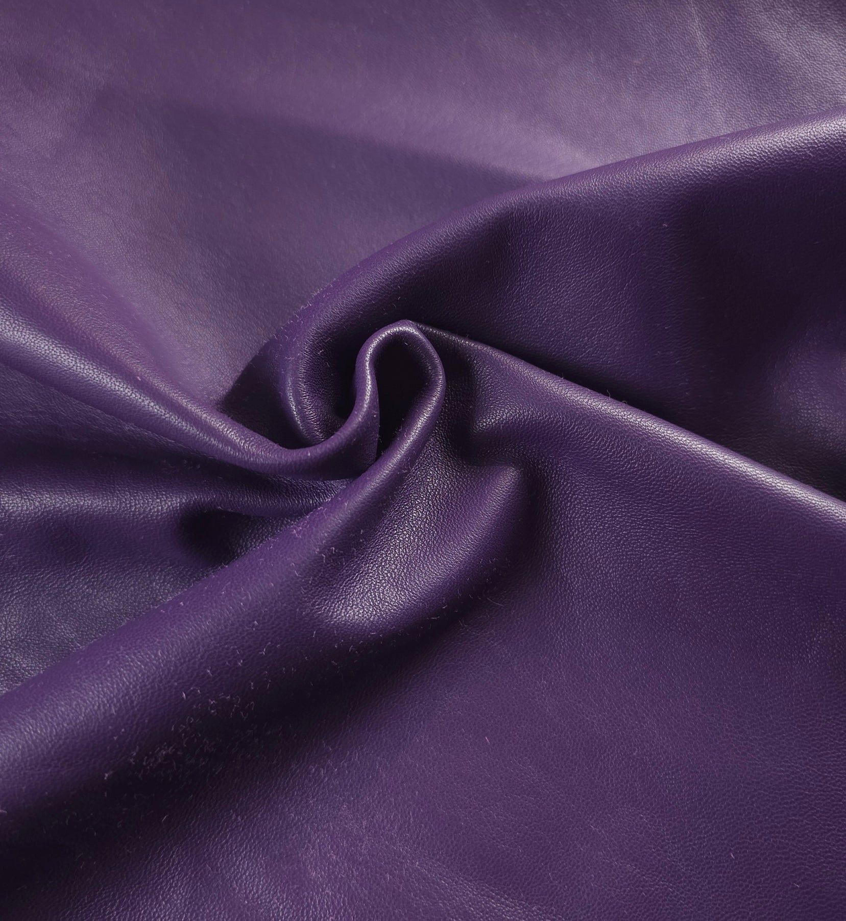 Buttery soft Sheepskin Nappa hides draped on table