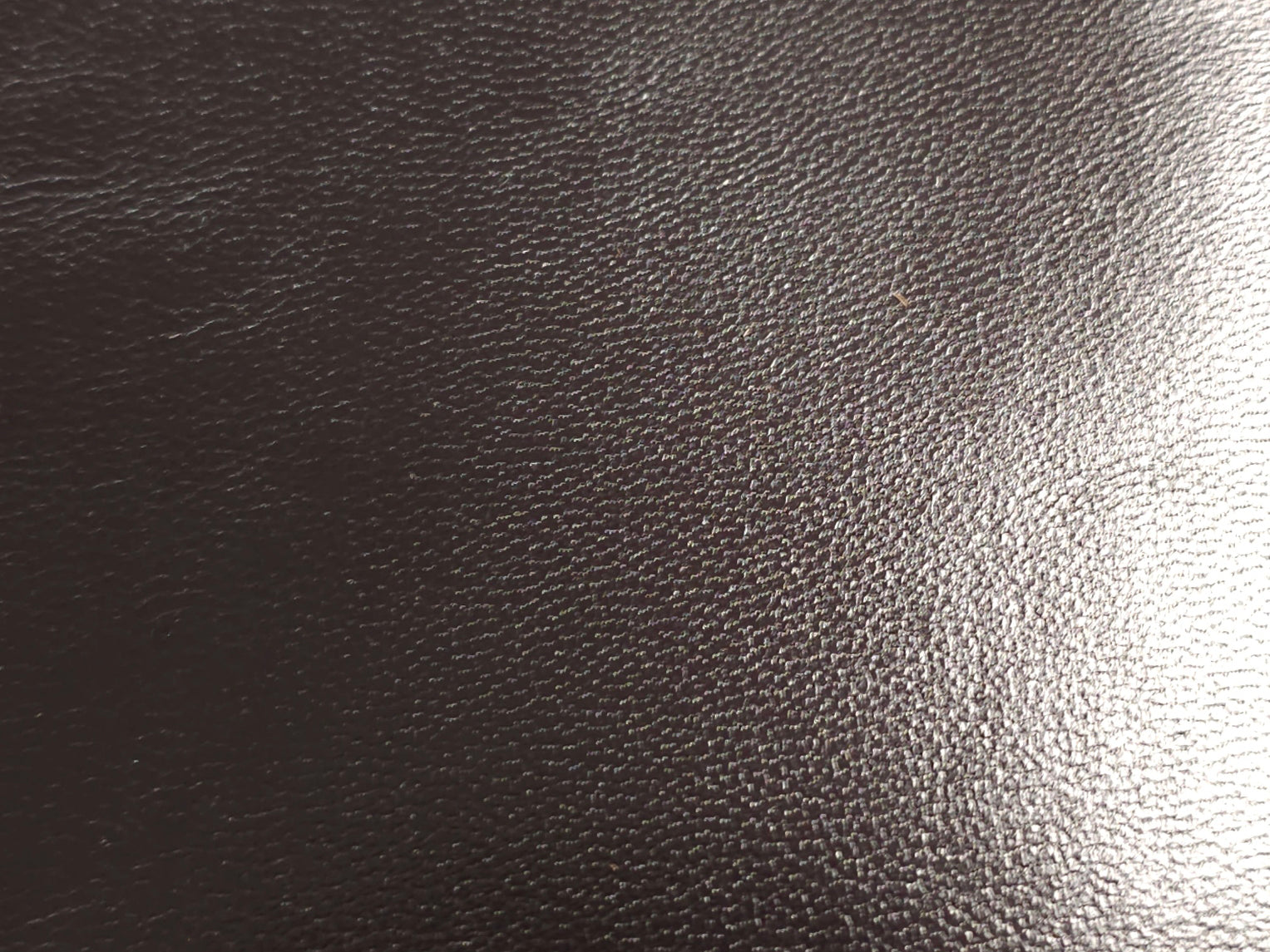 Fine grain texture close-up on goatskin leather