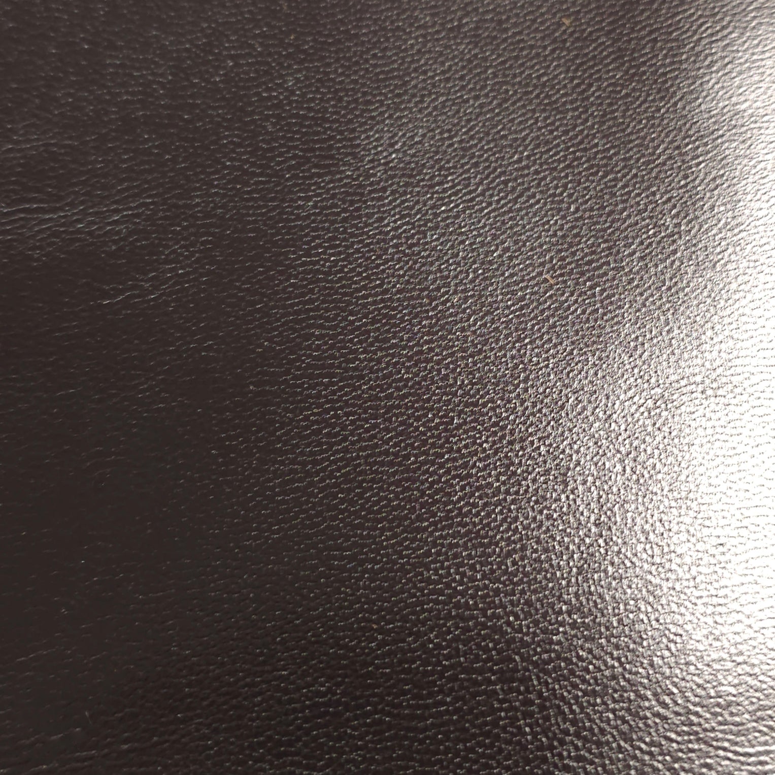 Fine grain texture close-up on goatskin leather