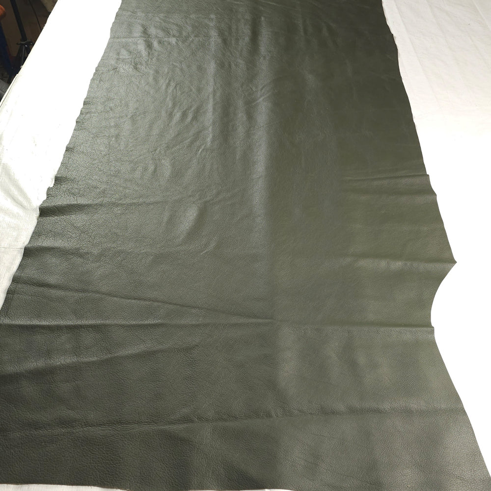 Dark olive corrected grain cowhide hide with smooth, uniform texture