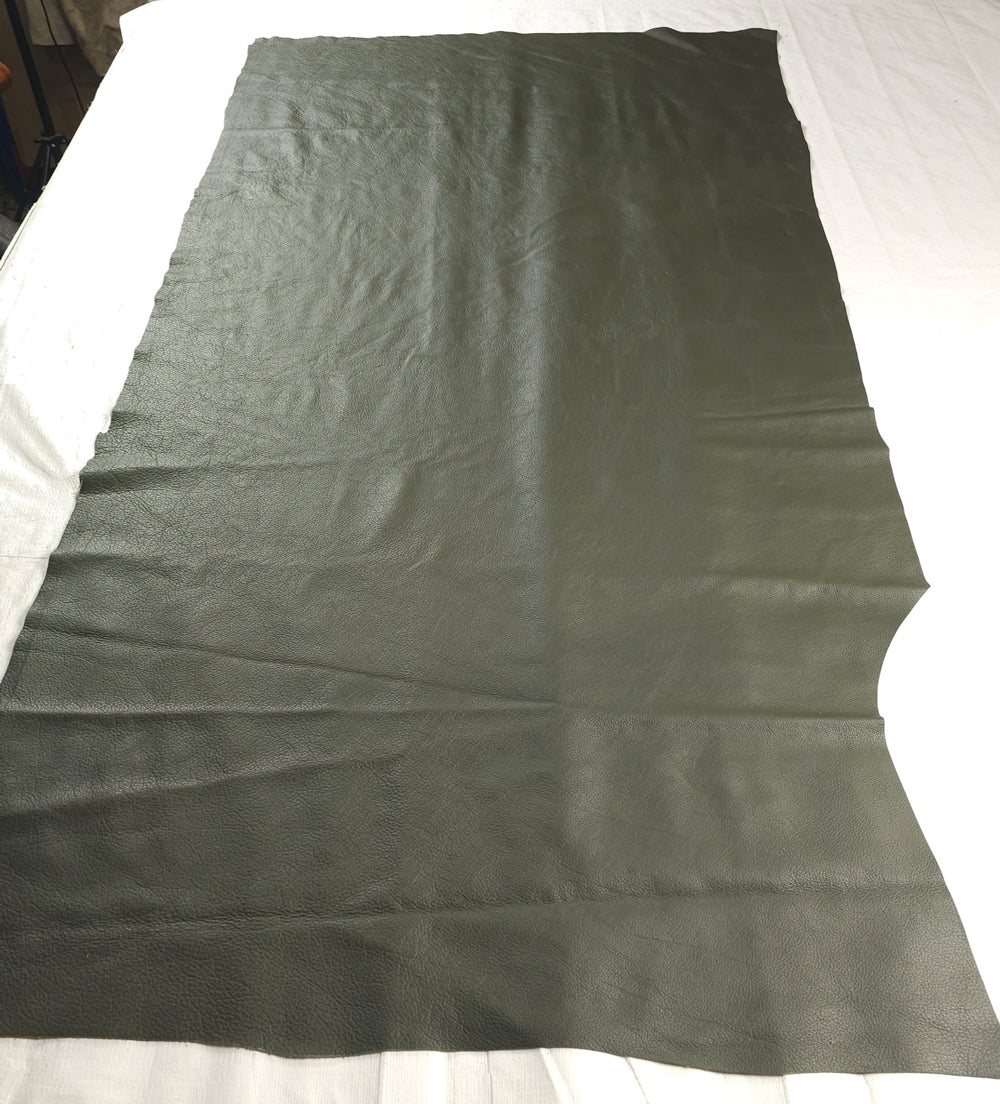 Dark olive corrected grain cowhide hide with smooth, uniform texture