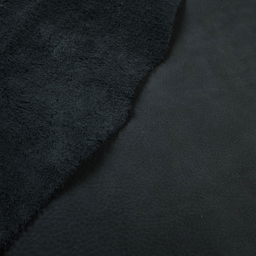 Semi-aniline leather piece showcasing natural grain and flexibility