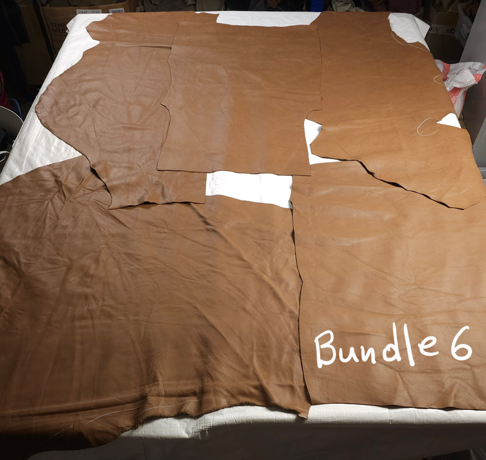 Close-up of cowhide leather showcasing natural scars and markings