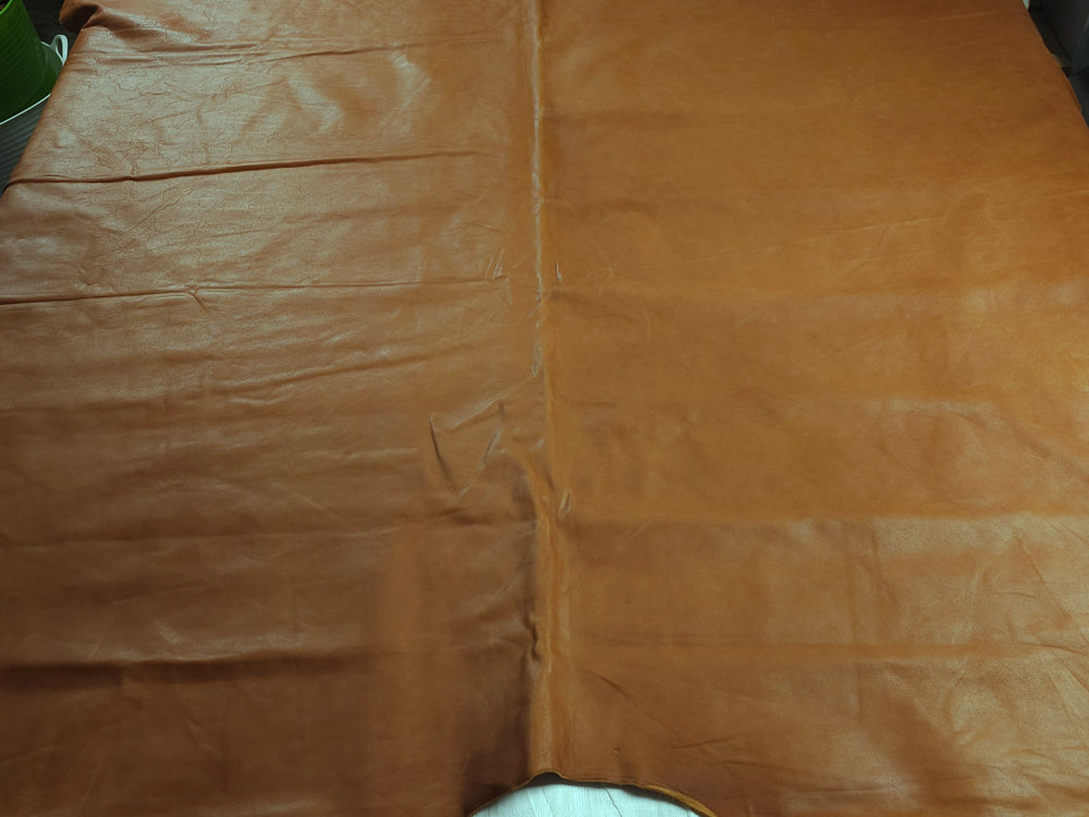 Tan veg tanned upholstery leather on table